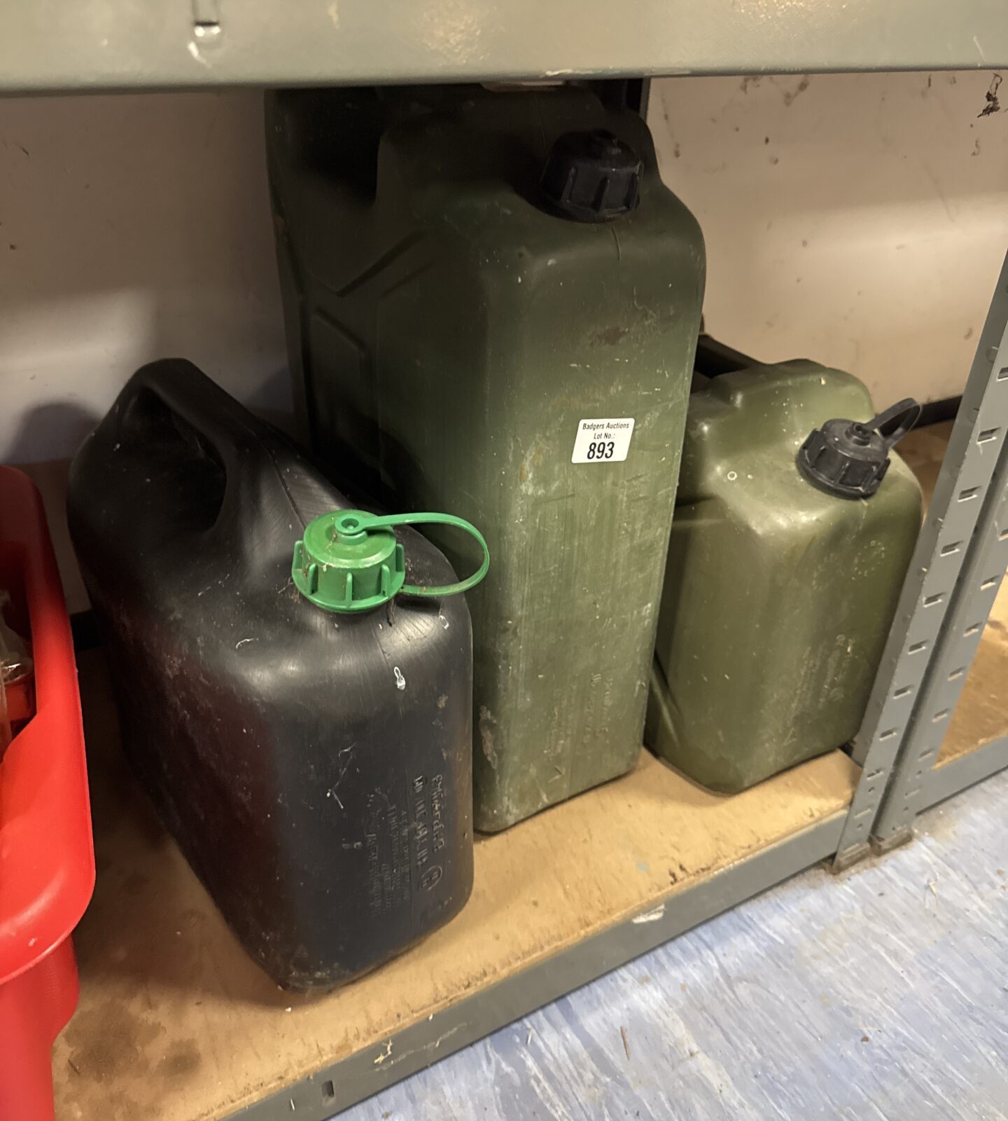 Three plastic Jerry cans