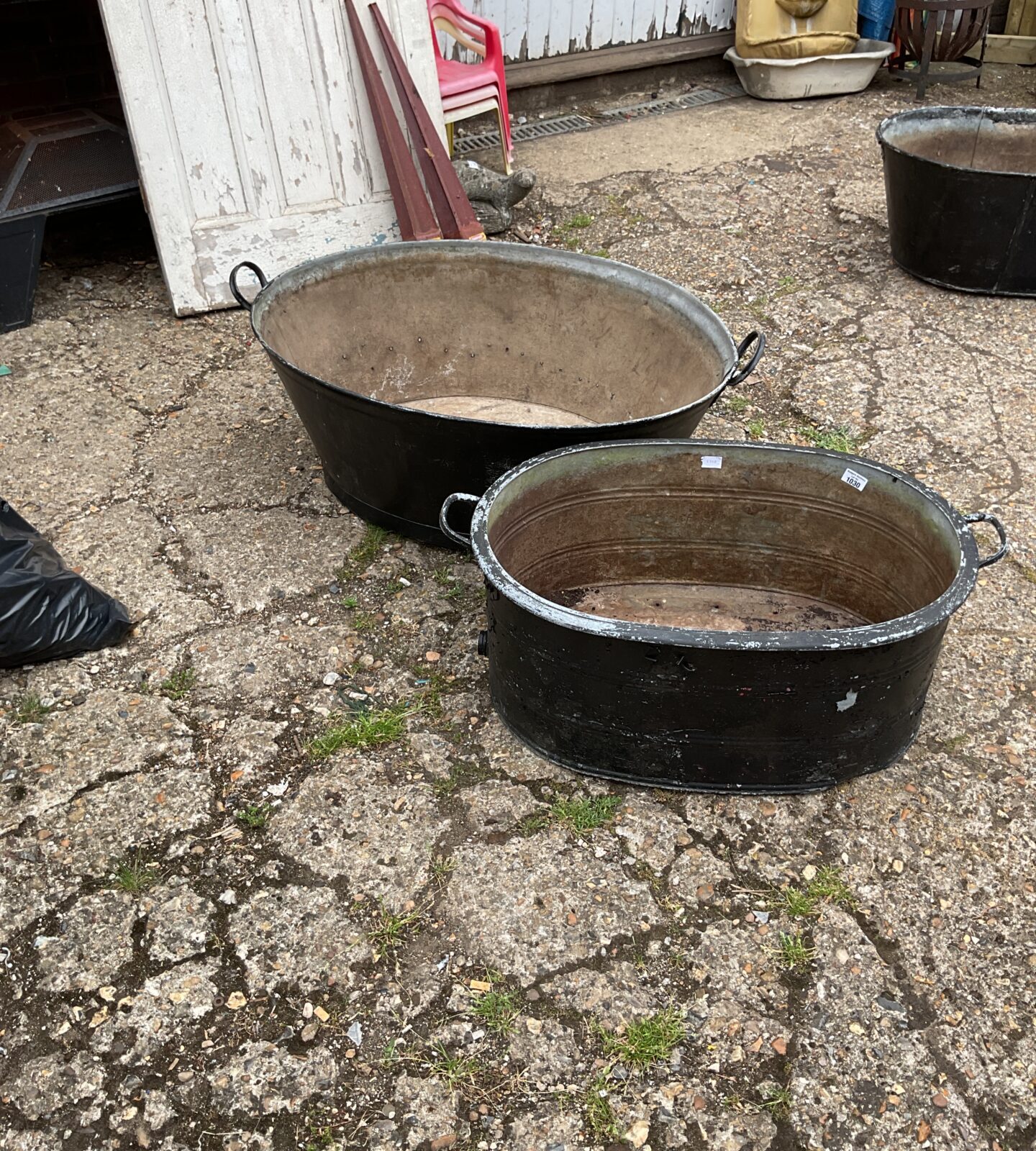 Two vintage galvanised baths