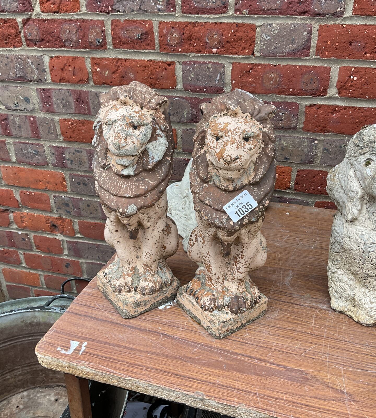 Two garden lion ornaments