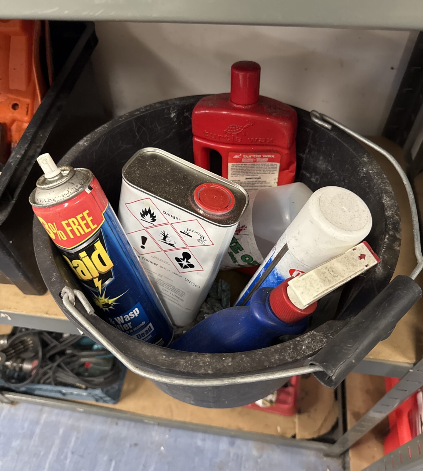 Plastic bucket with shed clearance chemicals contents