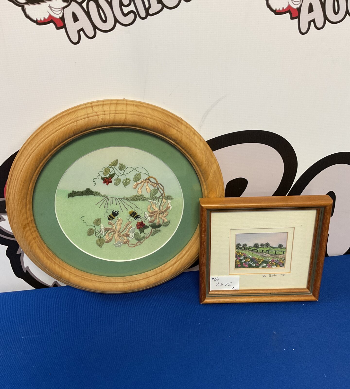 Two framed embroideries including jo banks