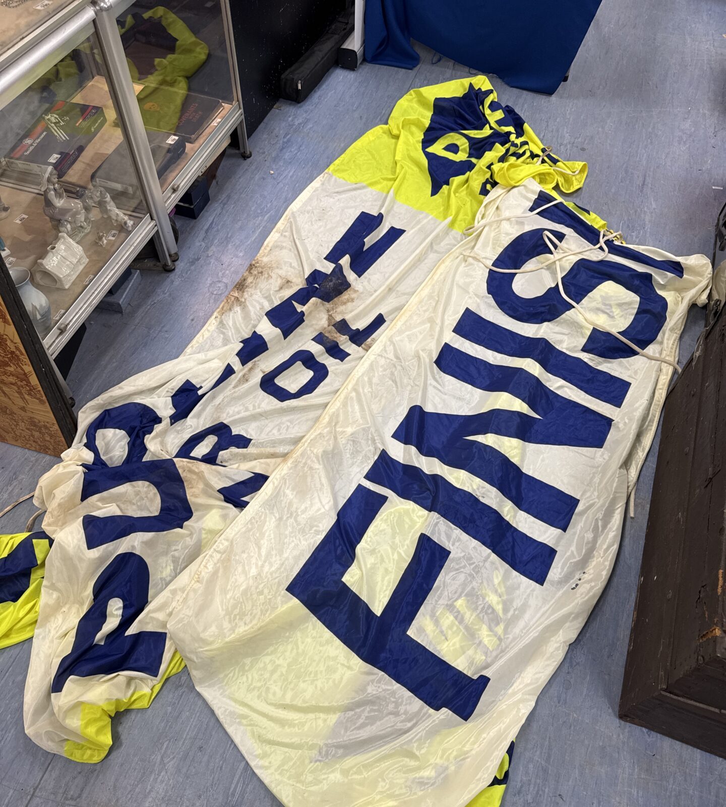 Two large banners from a racetrack inc finish line & putoline oil