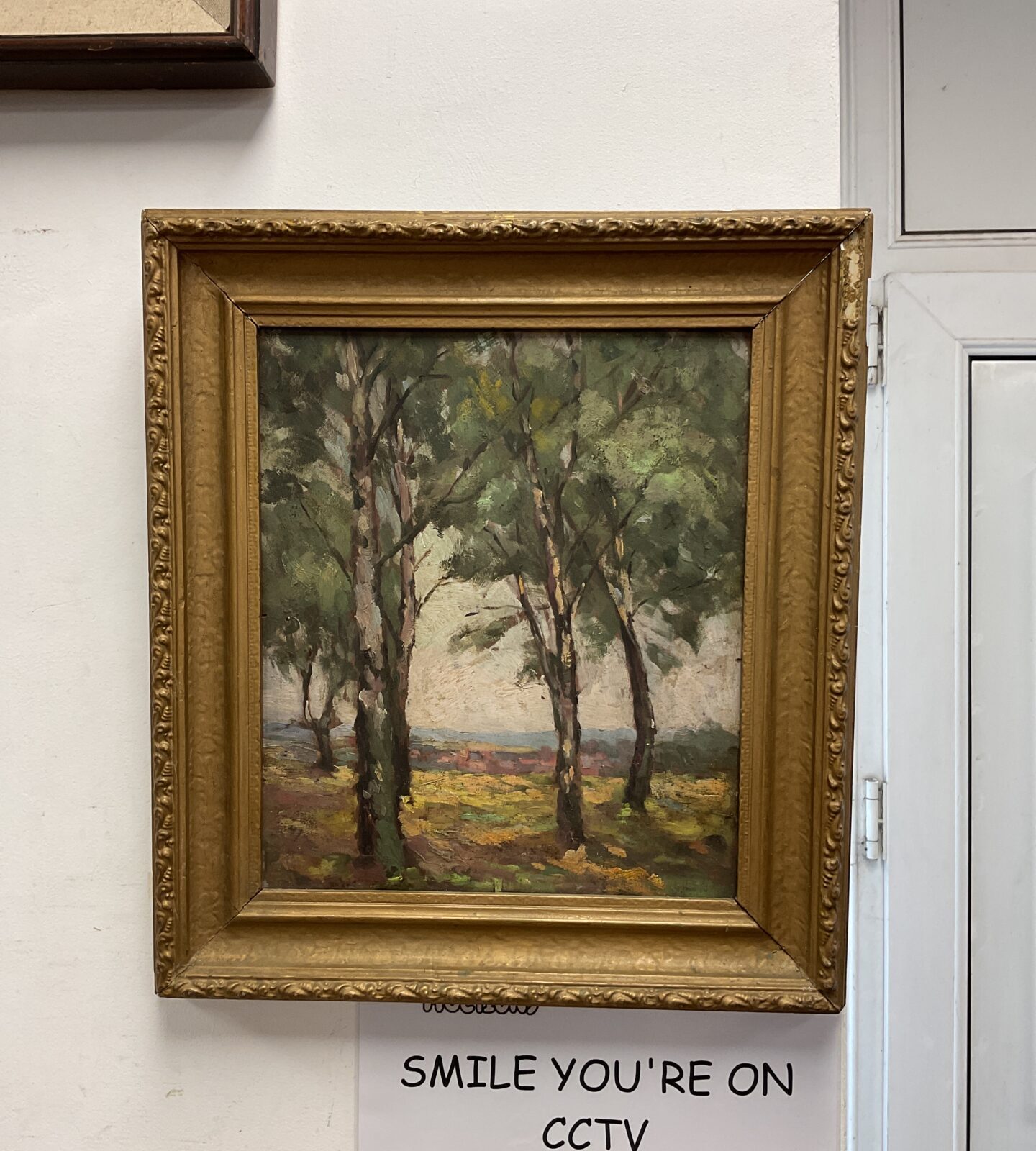 Framed oil on board woodland scene