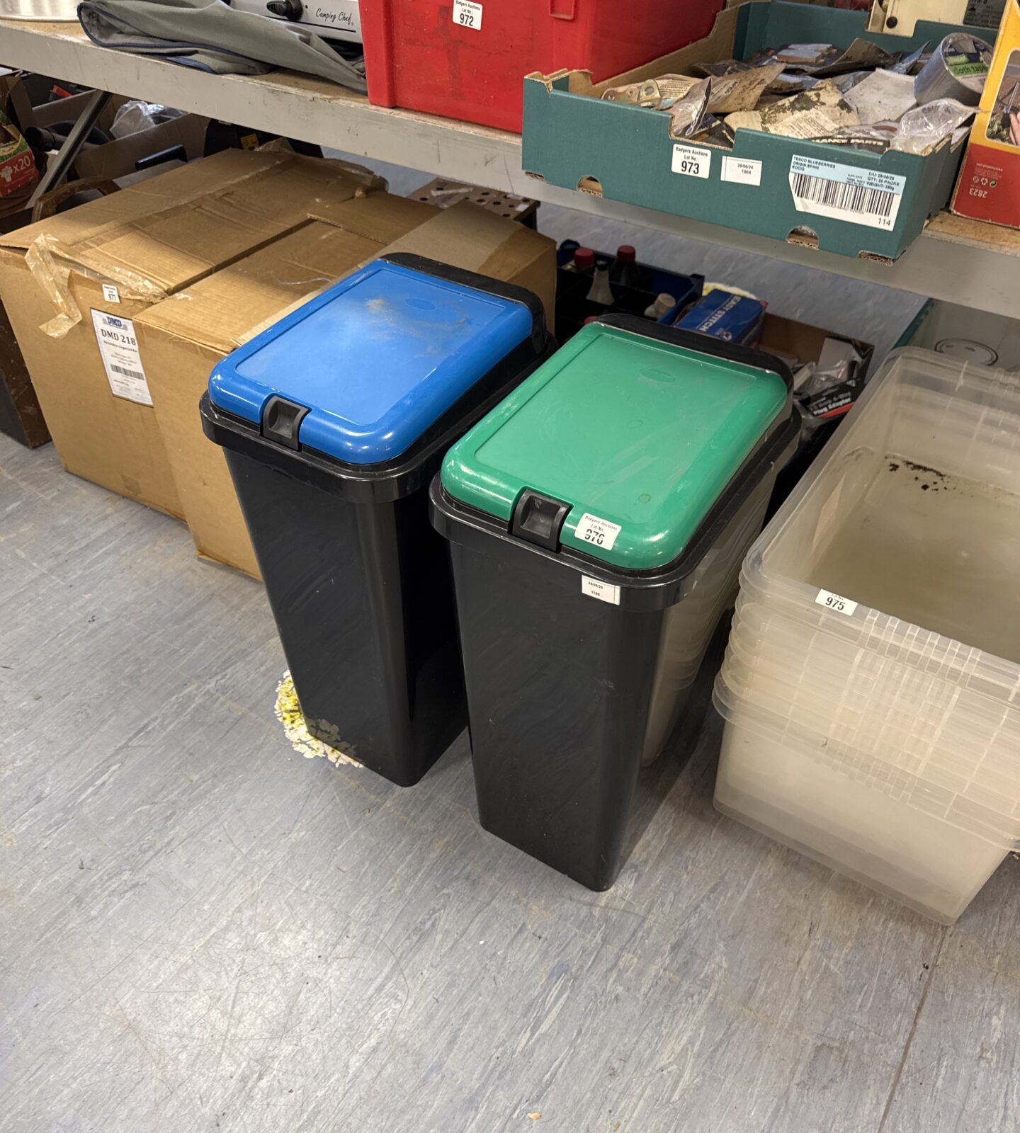 Two plastic flip top bins