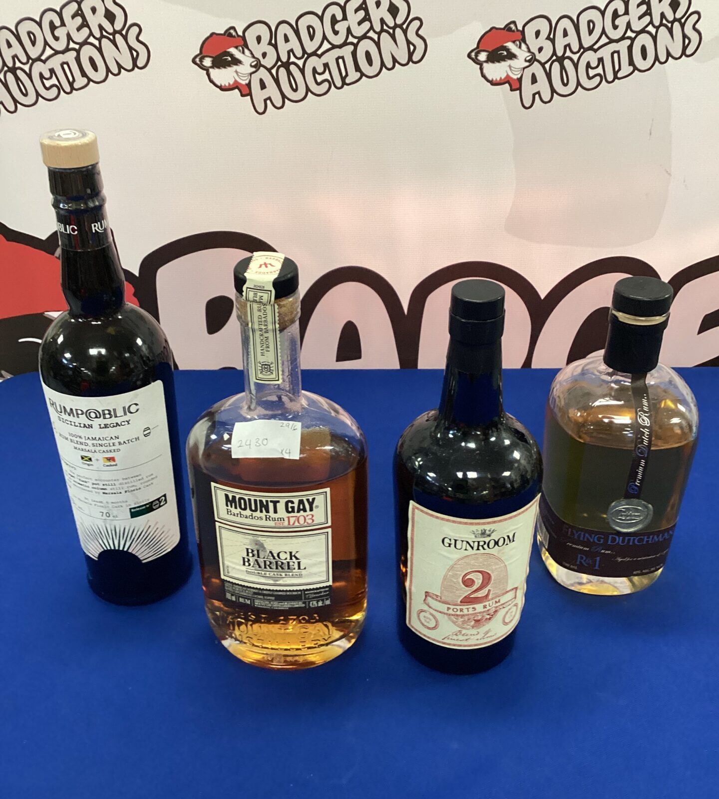 Four bottles of opened rum