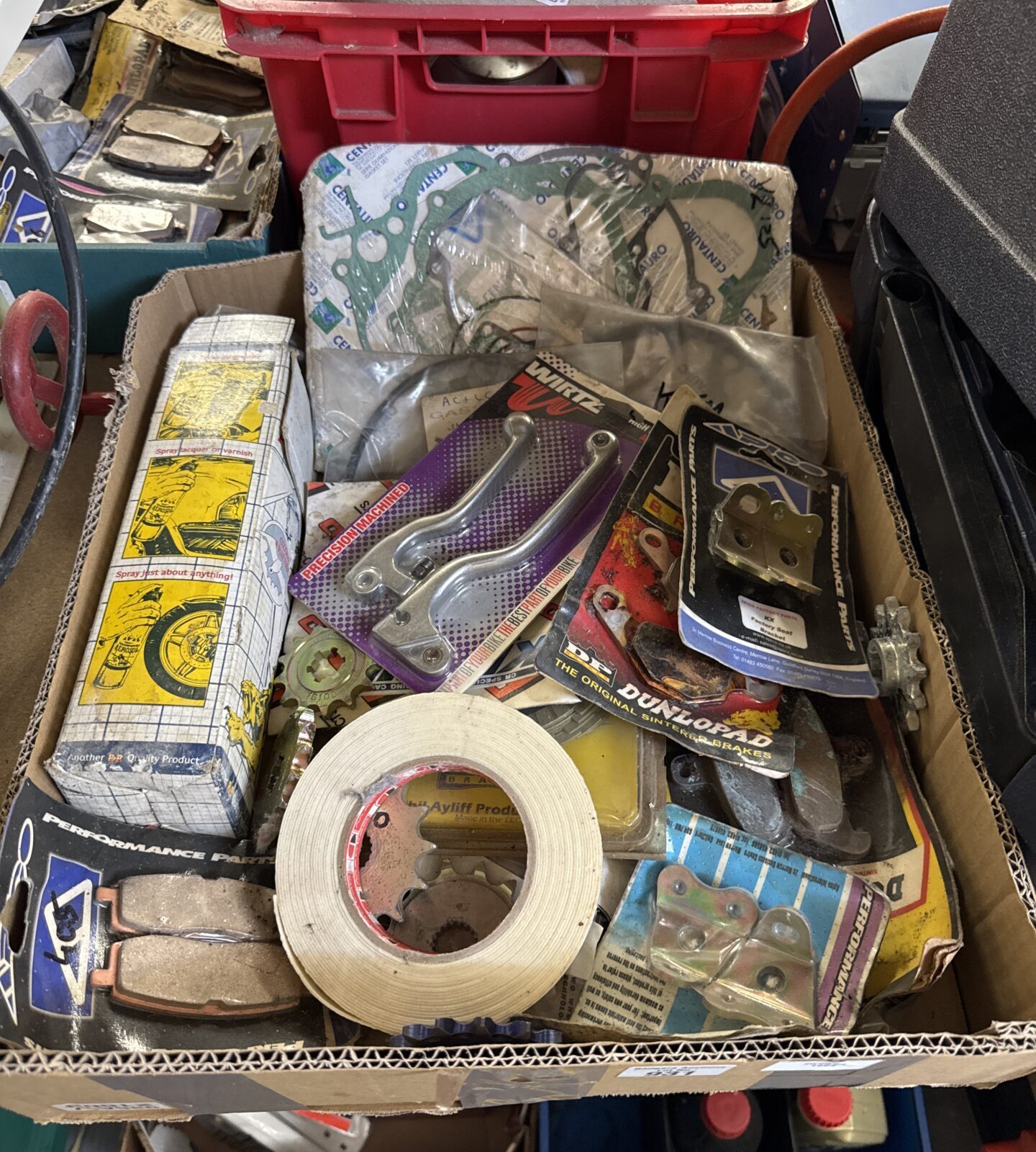 Tray of assorted motorcycle parts