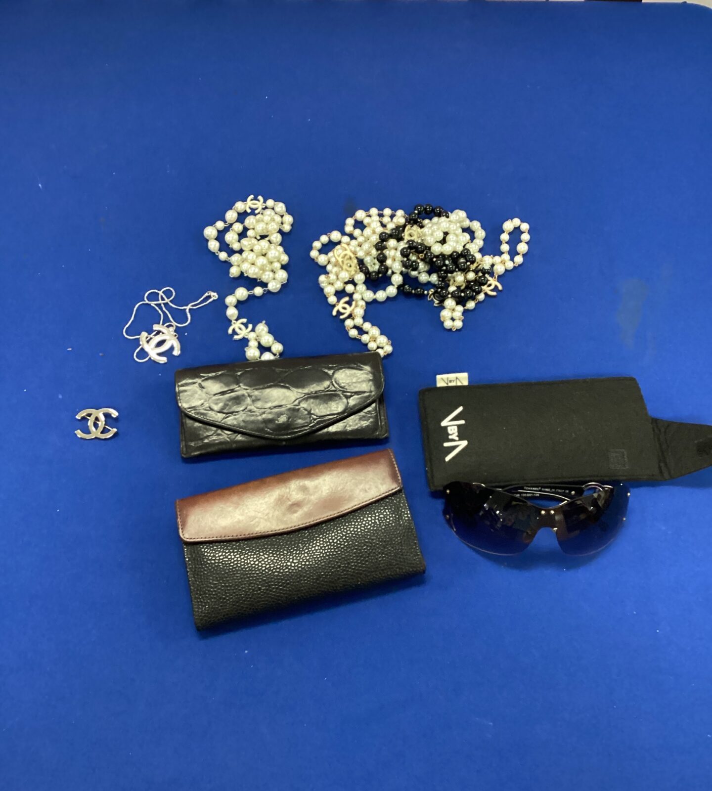genuine mulberry glasses case with items in the style of channel and mulberry