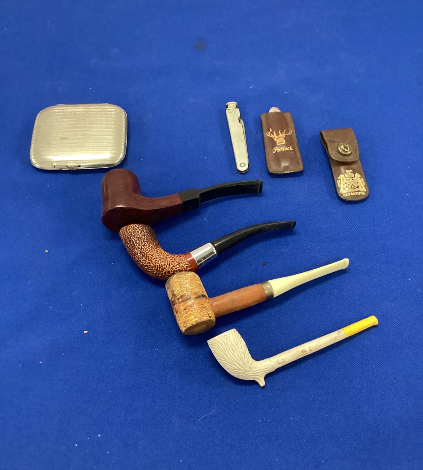 collection of pipes With cigarette case