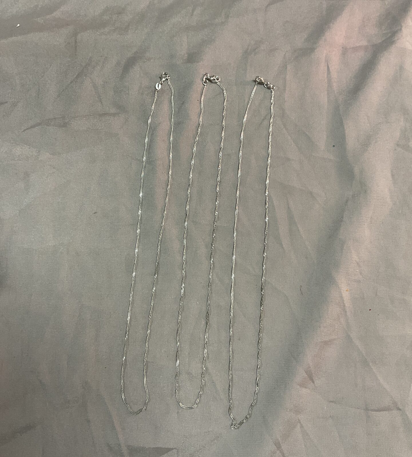 Three silver 20” necklaces