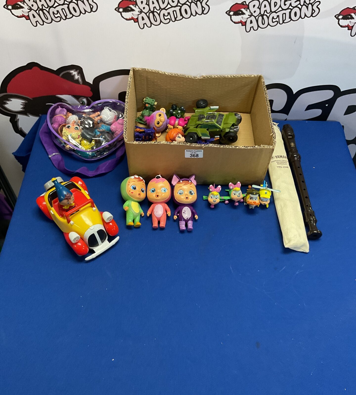 Box of mixed toys inc 1992 noddys car, lol surprise dolls, transformers and yamaha recorder