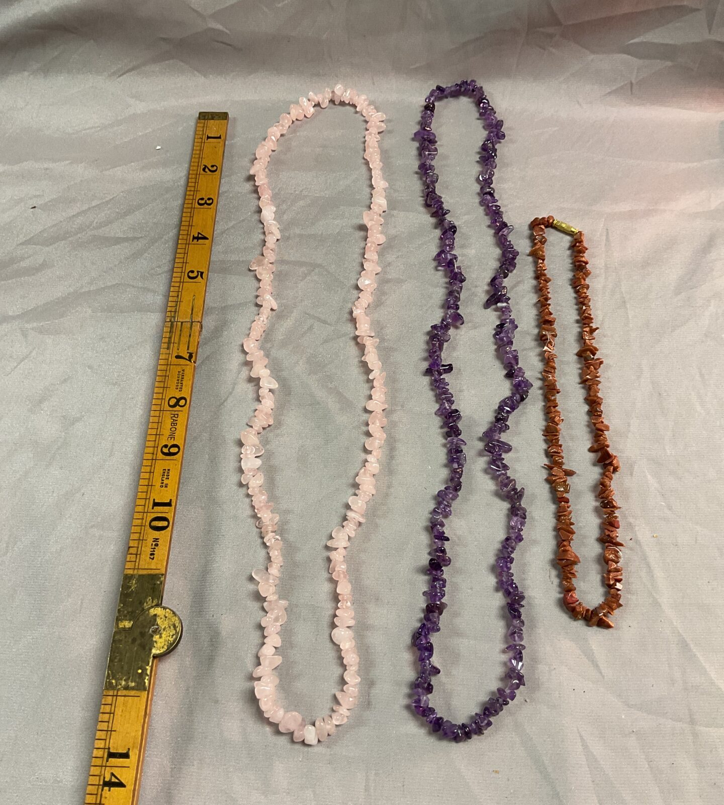 Three crystal necklaces