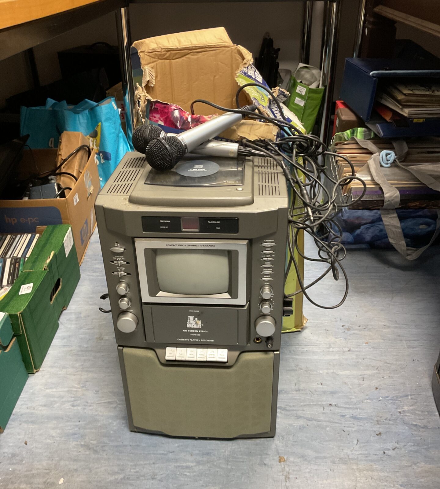 The singing machine karaoke system with mics & cds