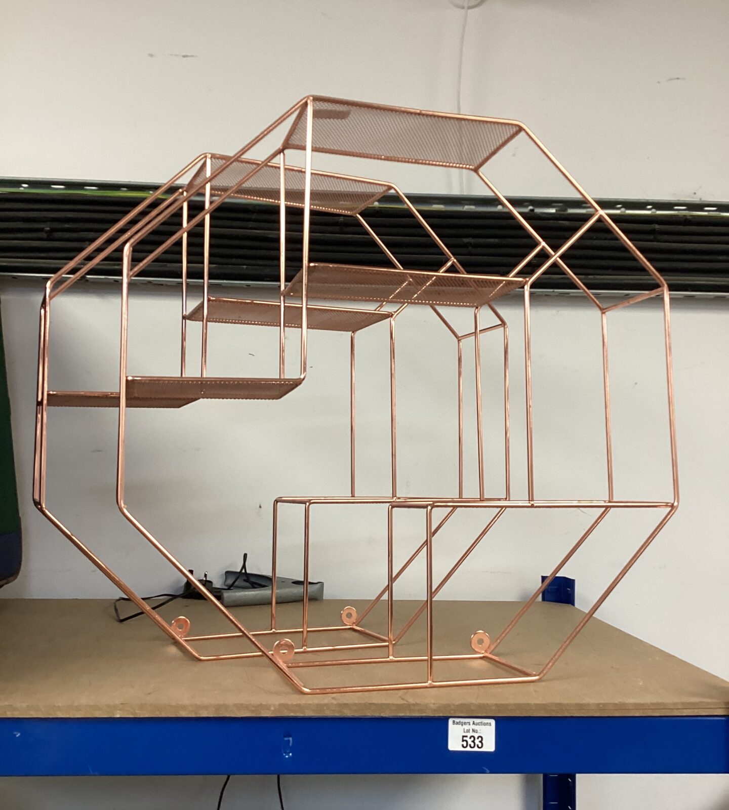 Two rose gold display shelves