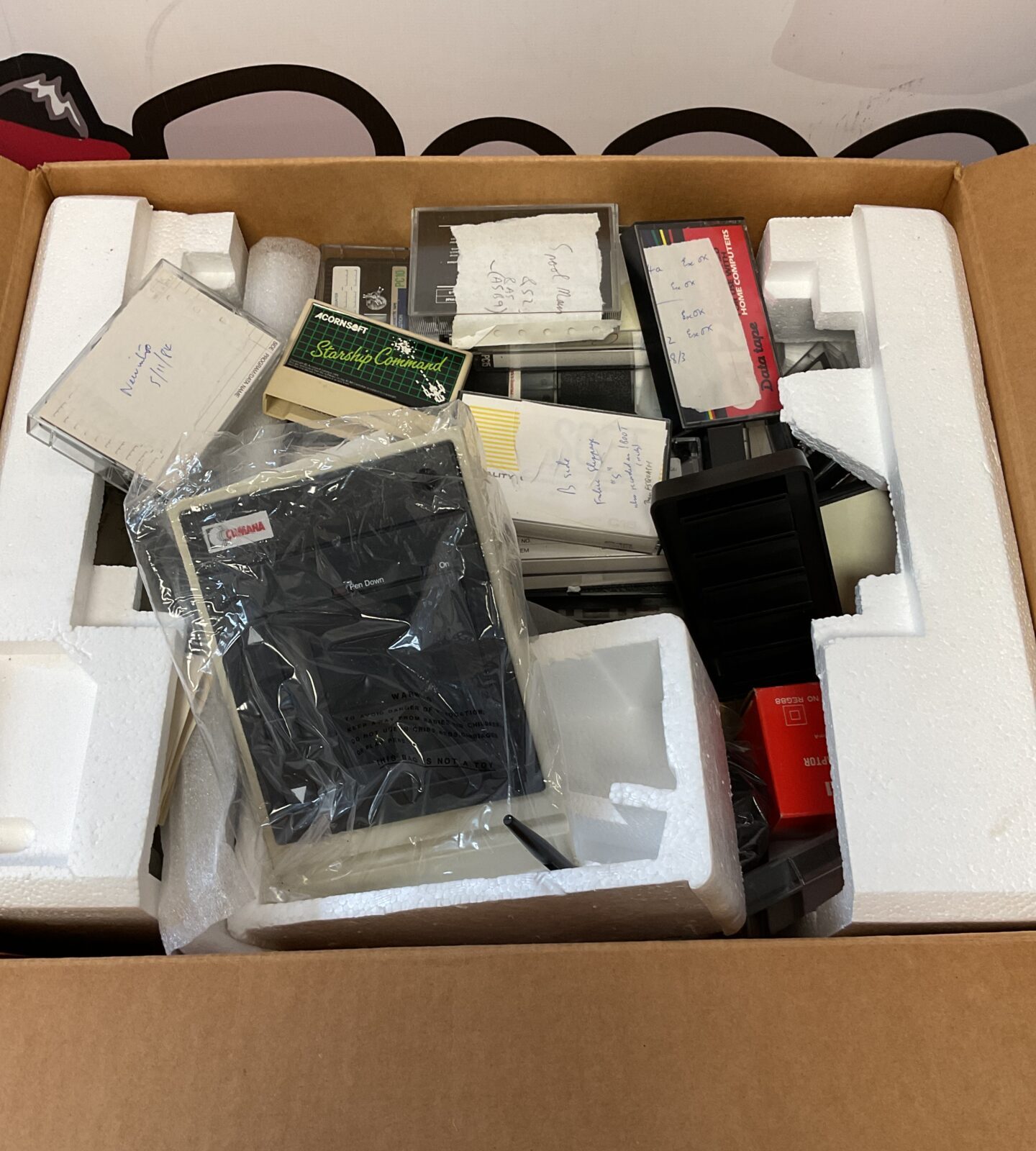 Box of acorn computer cassettes, cartridges & pen writer