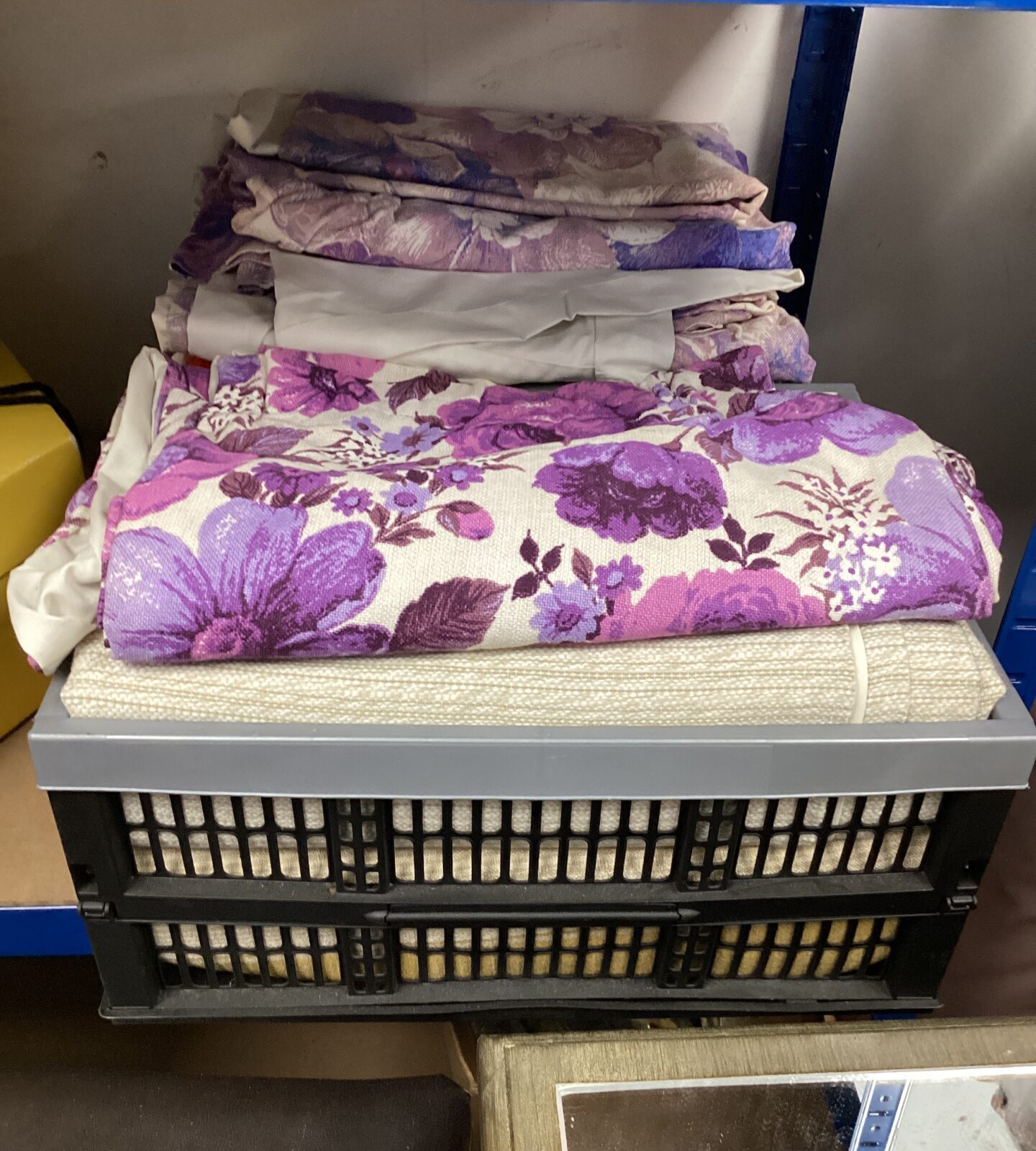Two baskets of curtains & bed linen