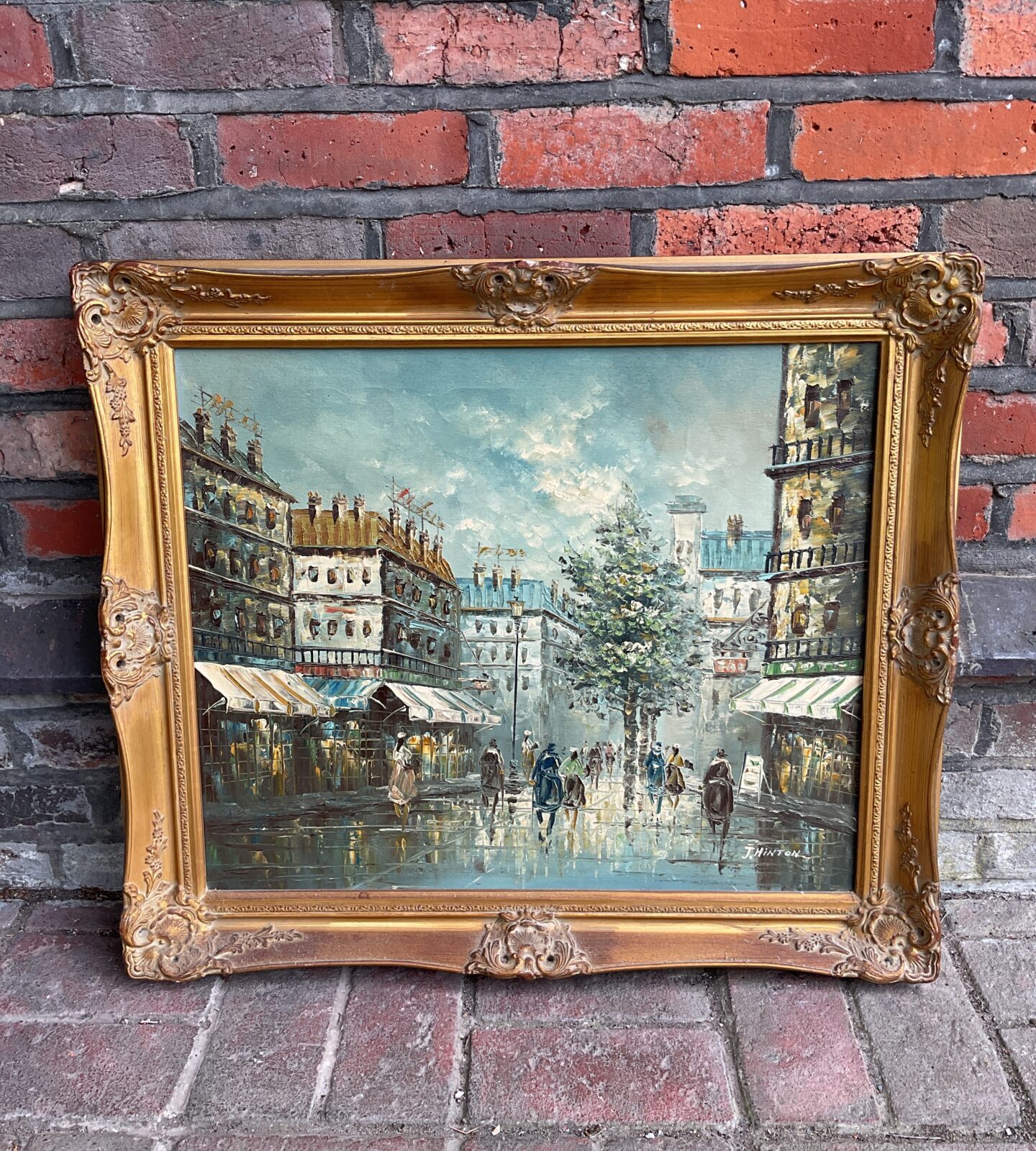 J hinton gilt framed oil painting of a french street scene