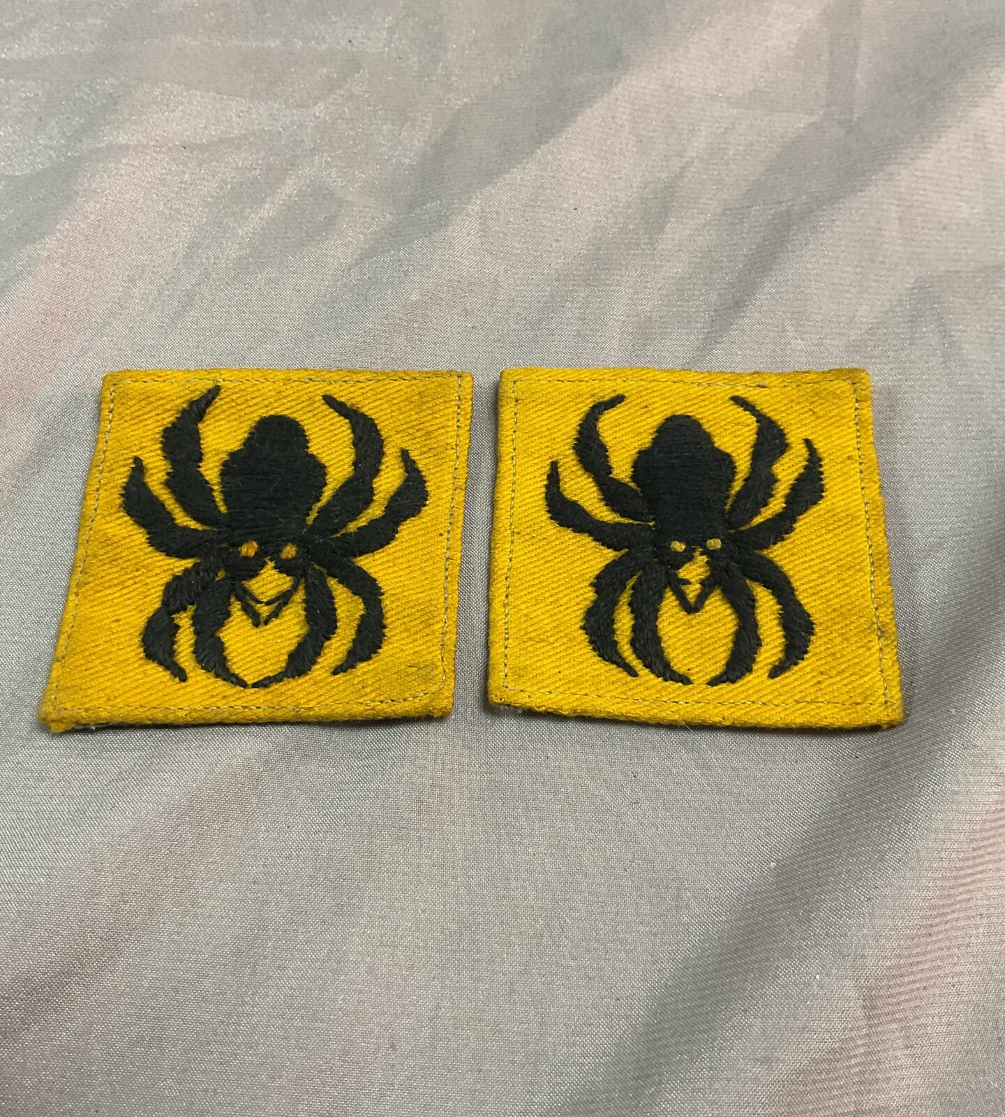 Two military cloth spider cloth badges