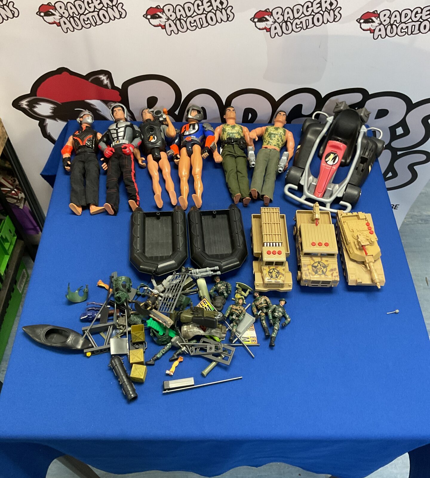 Box of retro action man figures and vehicles
