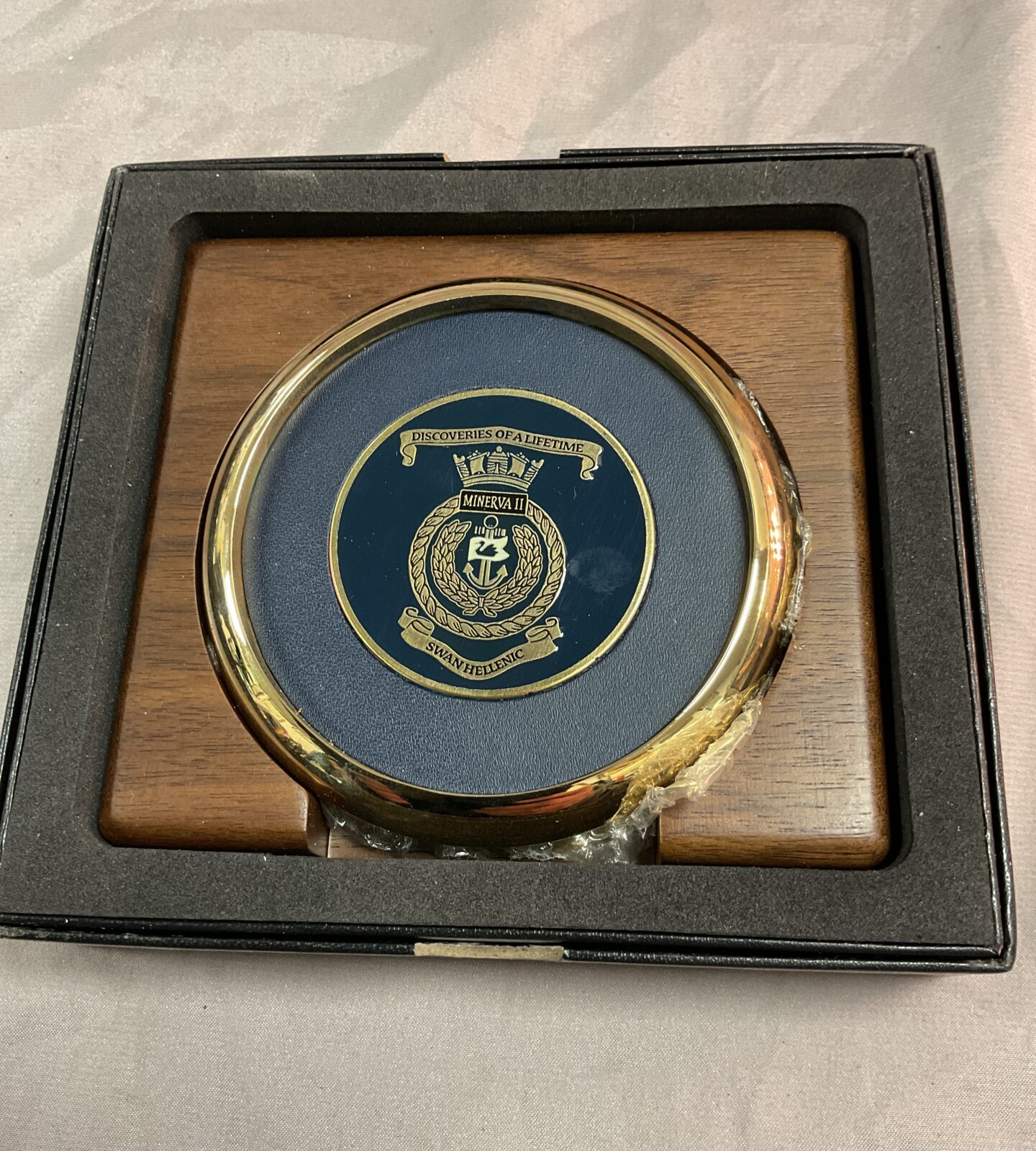 Two MV Minerva Il Swan Hellenic brass enamel coasters
