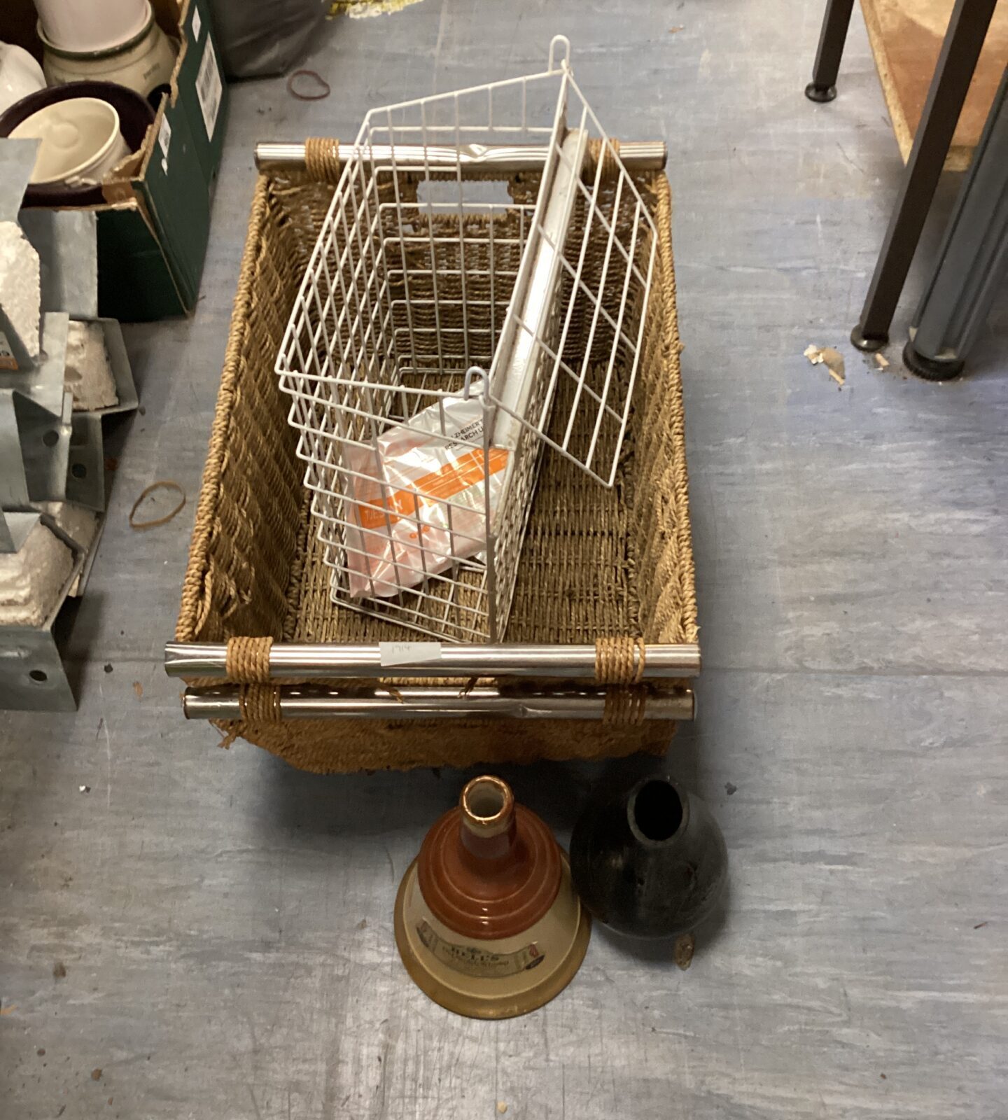 Two wicker baskets, wire framed baskets, bells whisky bottle & black vase