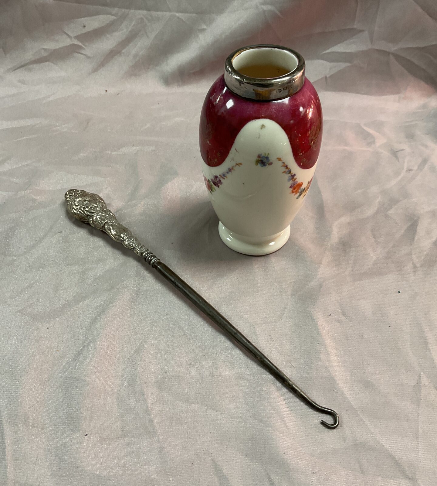 Hallmarked silver handle bootlace hook and silver mounted vase