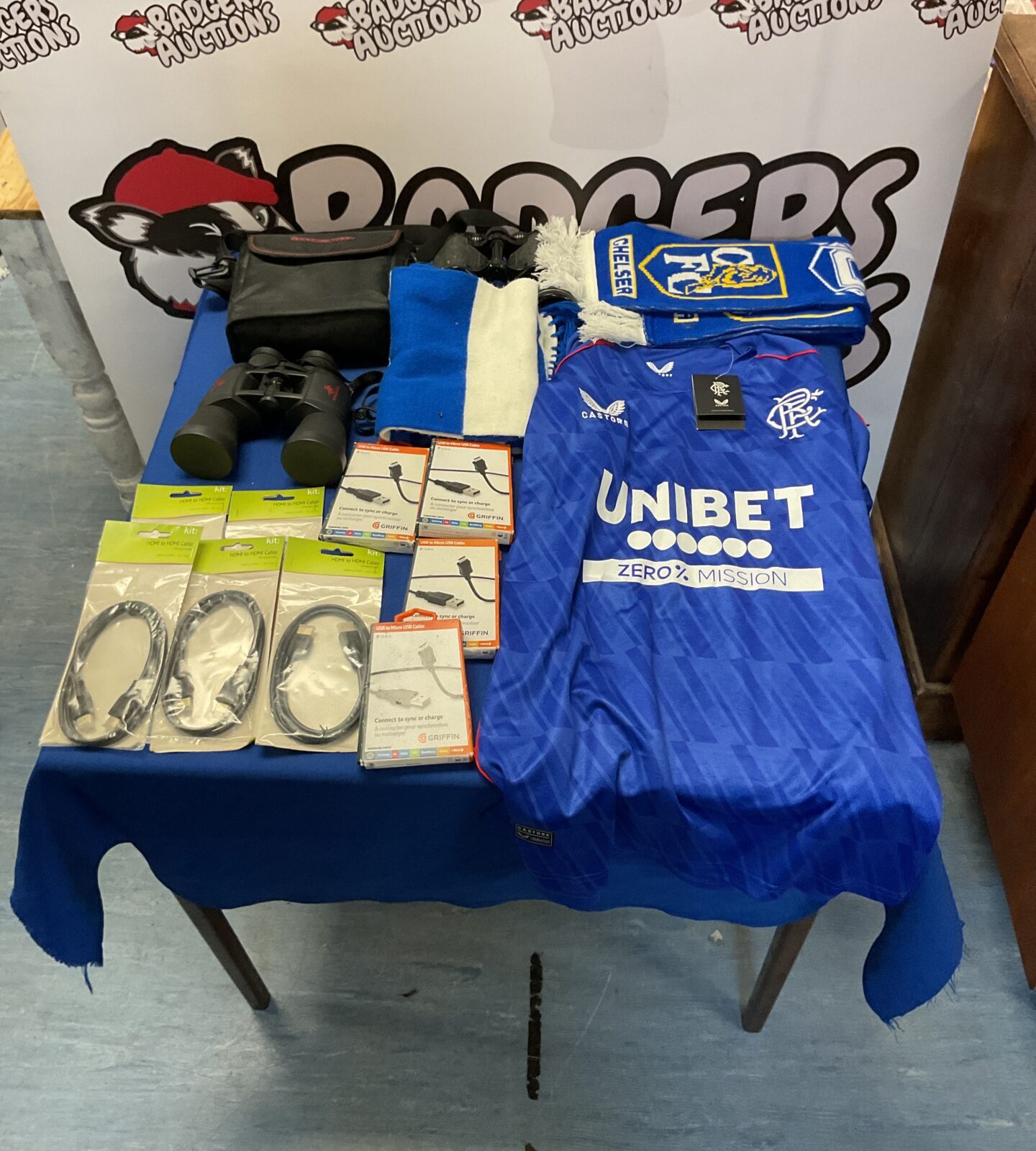 Box of mixed inc football items inc rangers shirt, two biniculars inc winchester and cables inc hdmi and micro usb