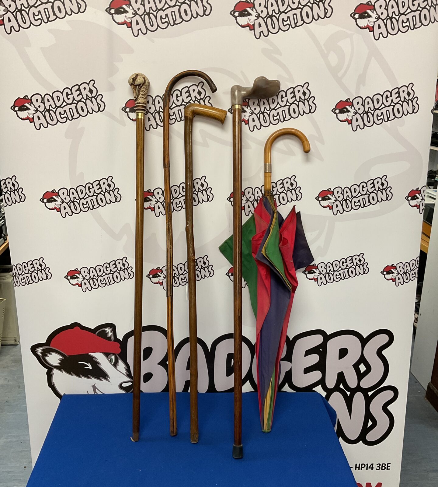 Bundle of vintage walking sticks & umbrella with silver cuff
