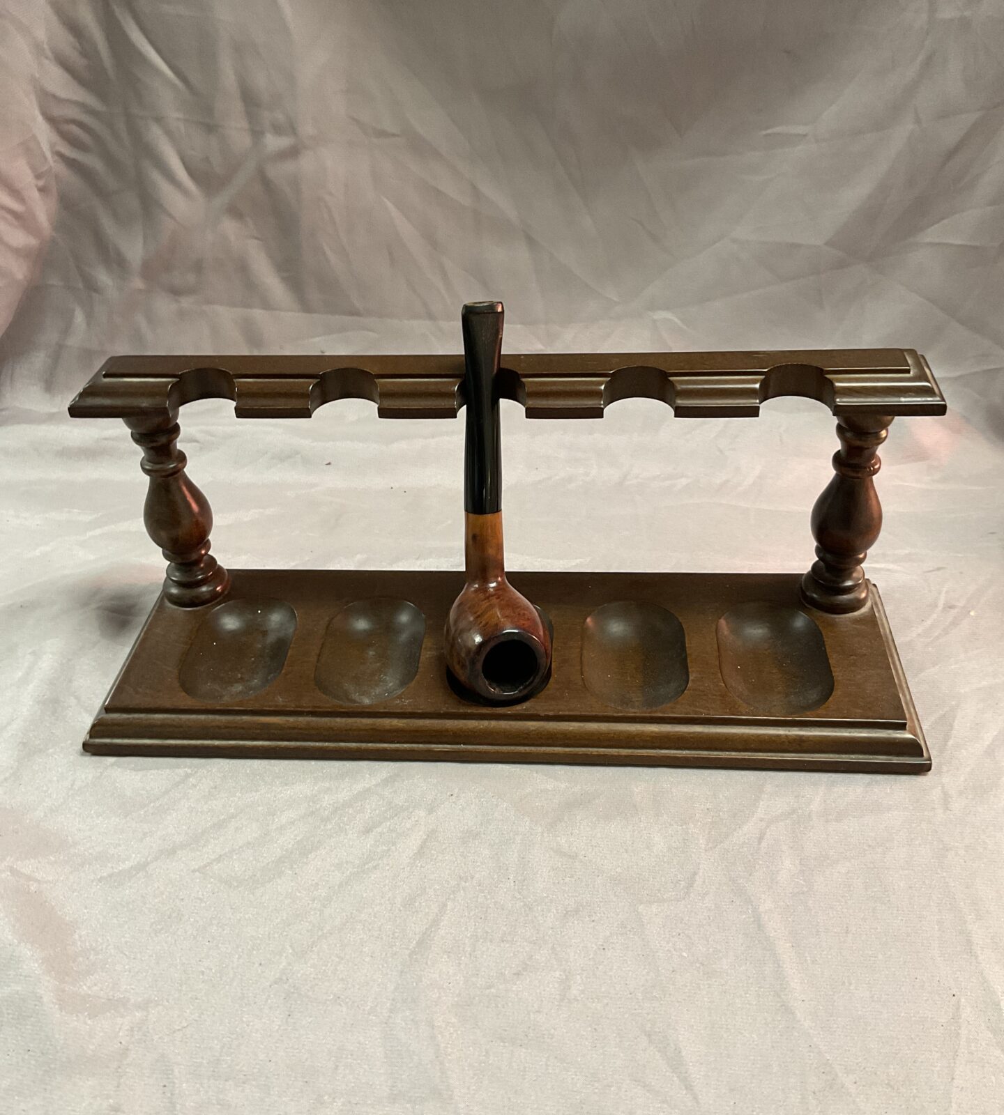 Vintage pipe rack with pipe