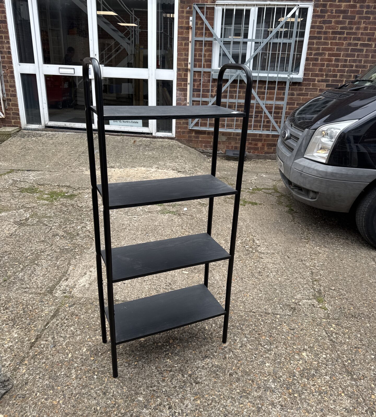 Four tier shelving unit with wooden shelves 58” tall x 25.5” width x 11” depth