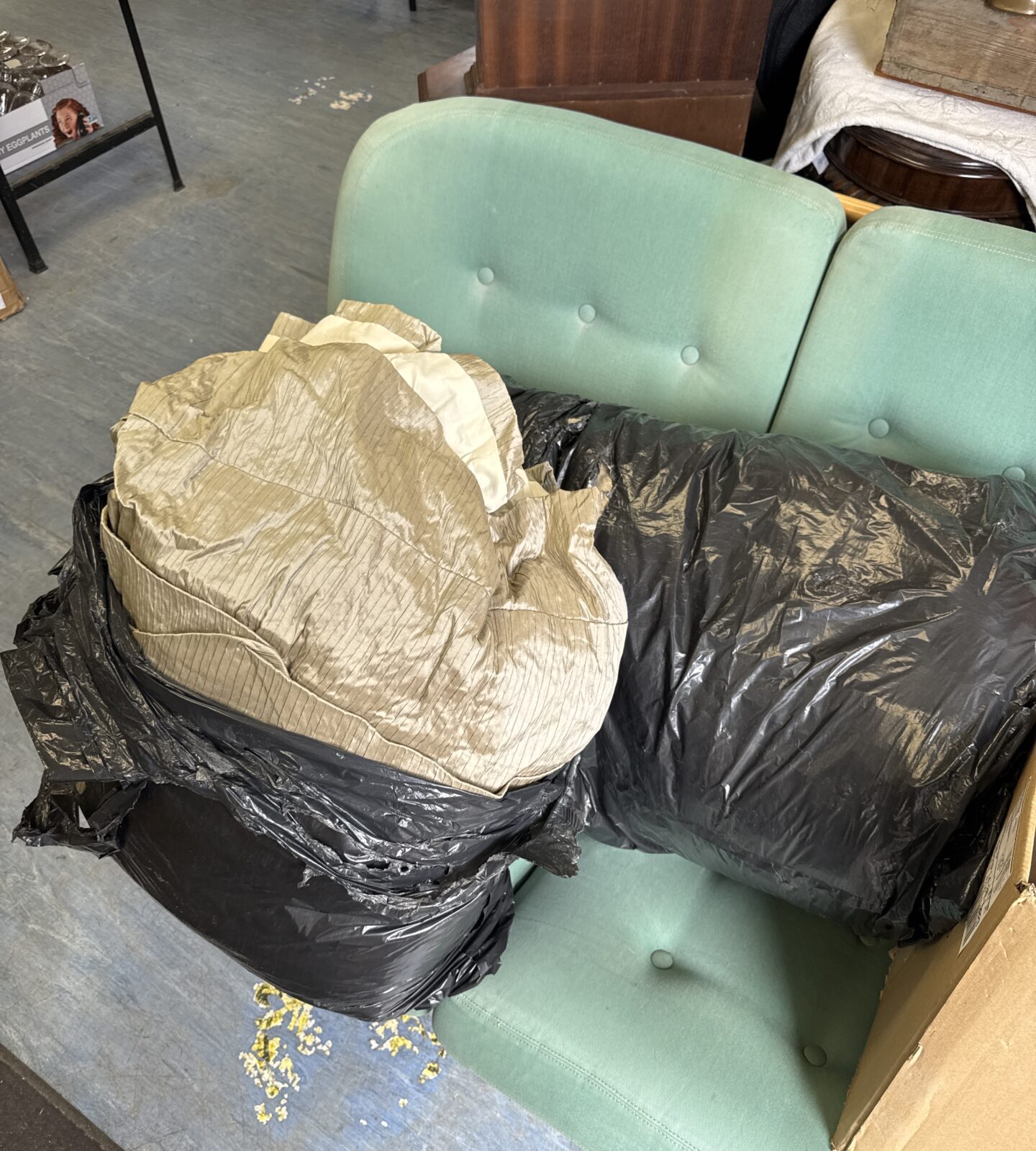 Two bags of very large silver/grey silk curtains originally made for a bank foyer