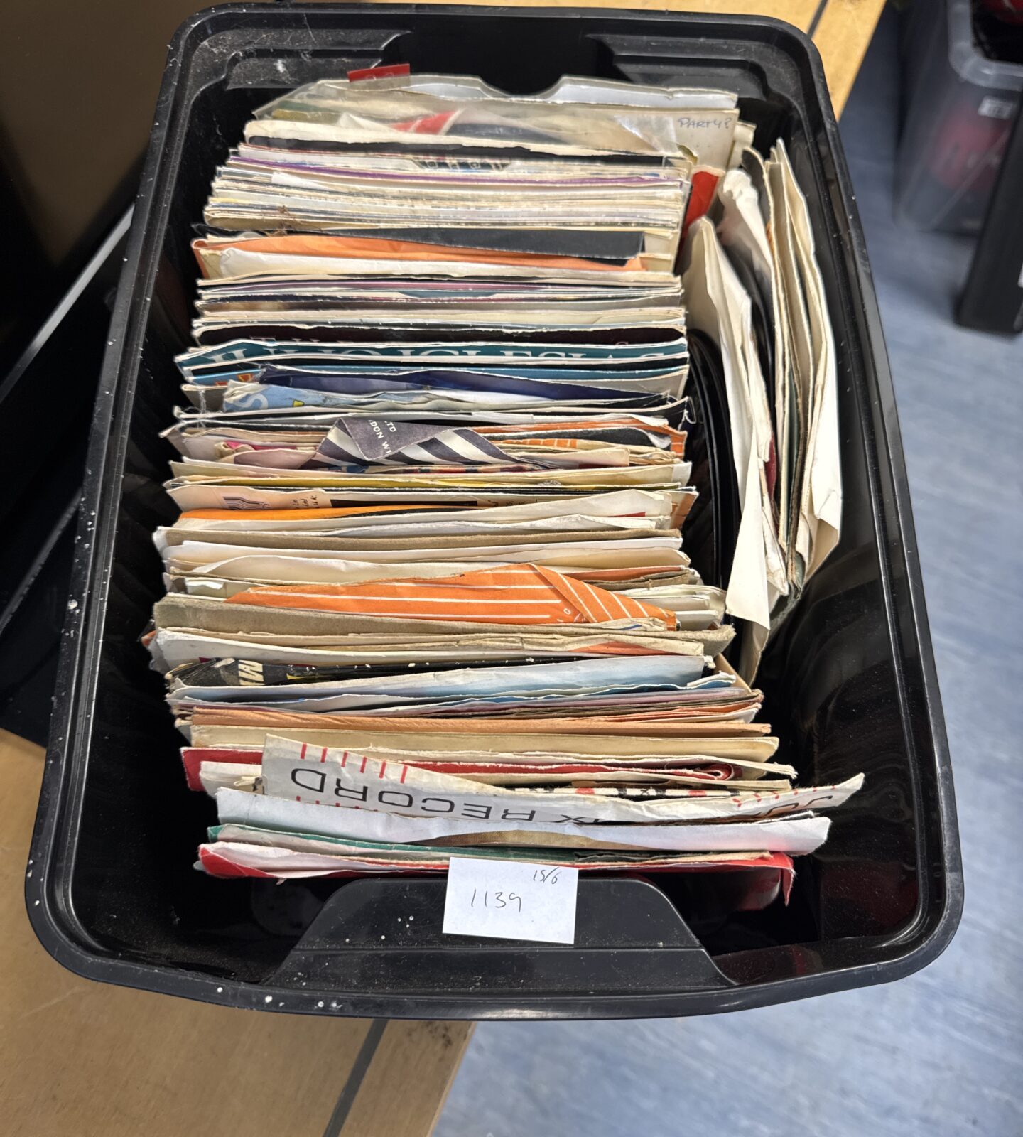 Box of assorted 7” single vinyl records