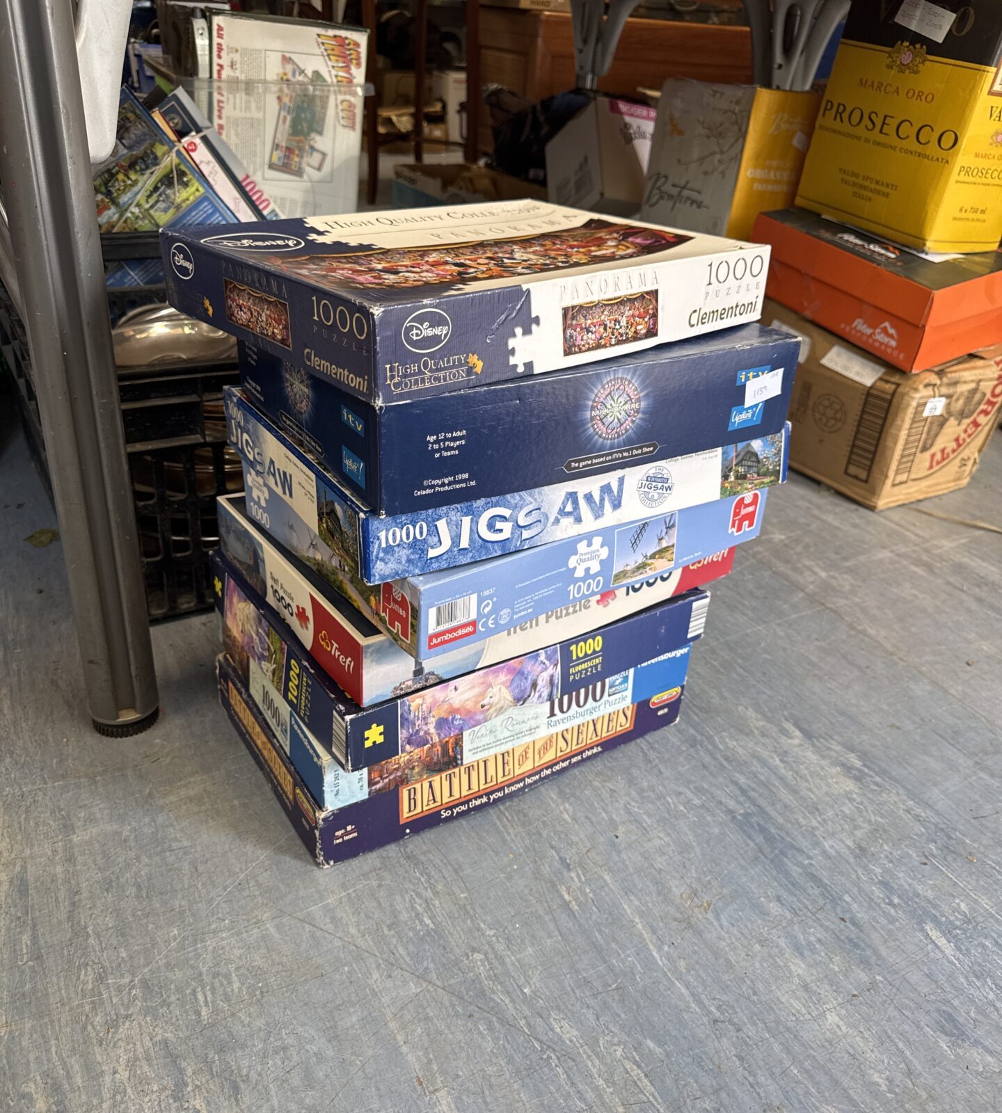 Bundle of assorted jigsaw puzzles with battle of the sexes game