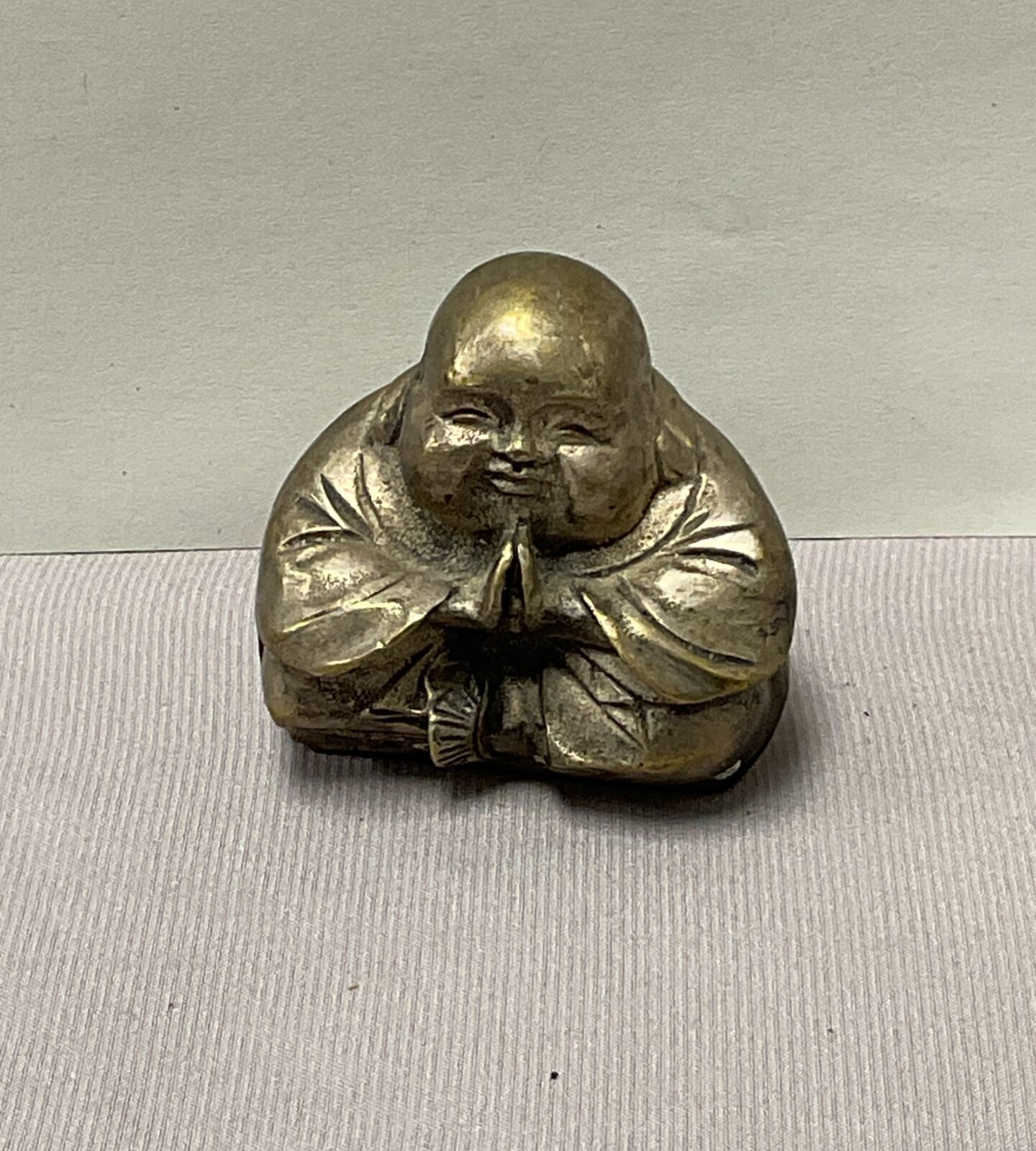 small 2” whitemetal smiling budda