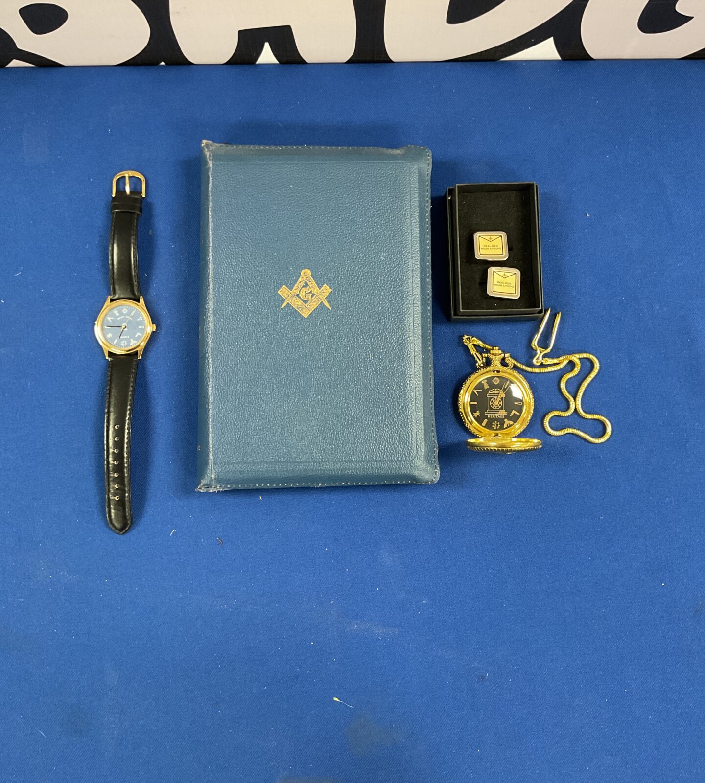 Box of mixed masonics inc wristwatch, pocketwatch, cufflinks and bible