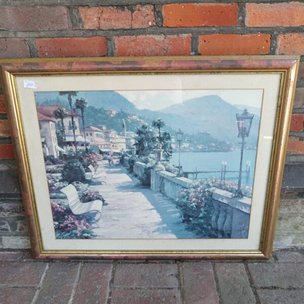 Large framed print of a continental coastal town scene
