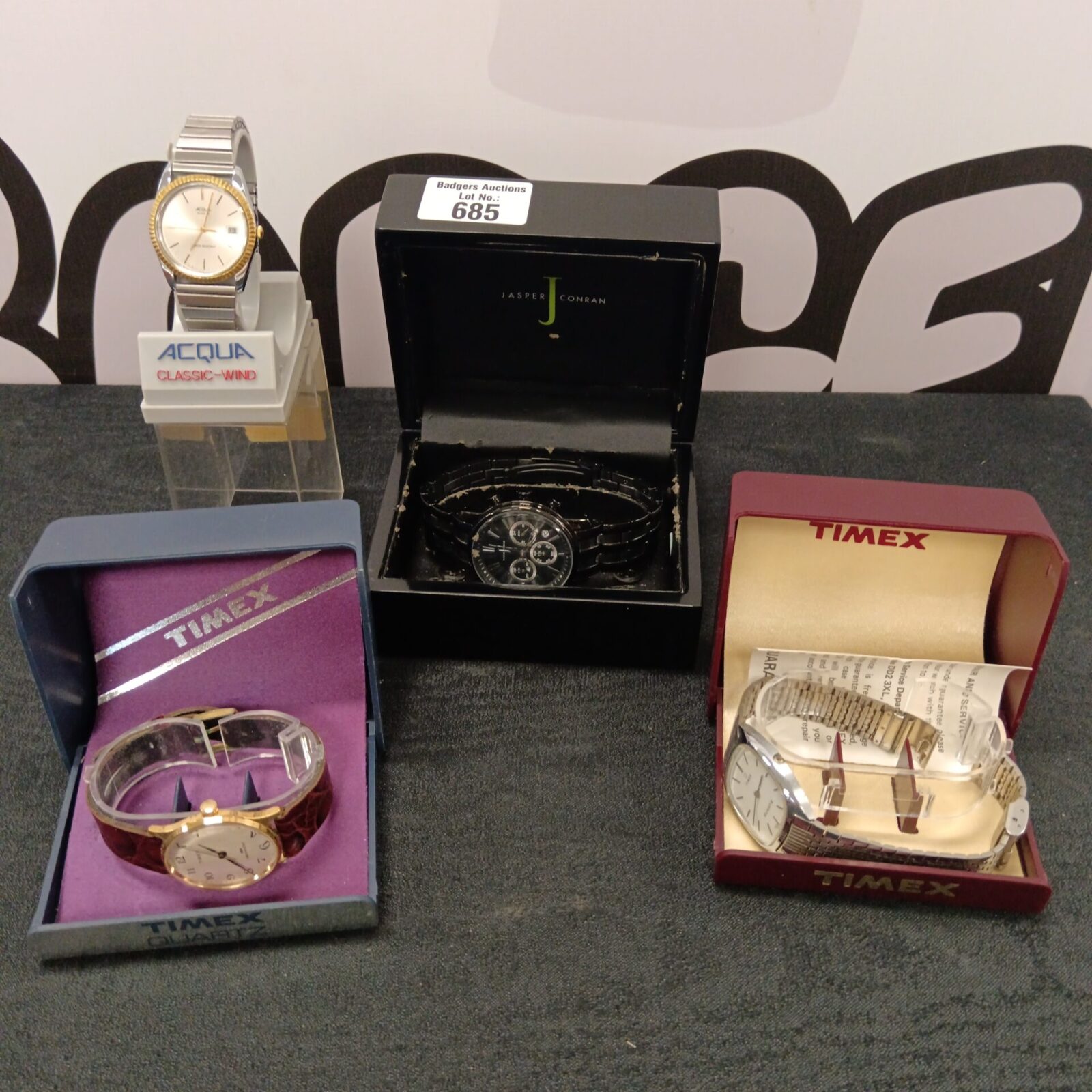 Four boxed watches including acqua & timex