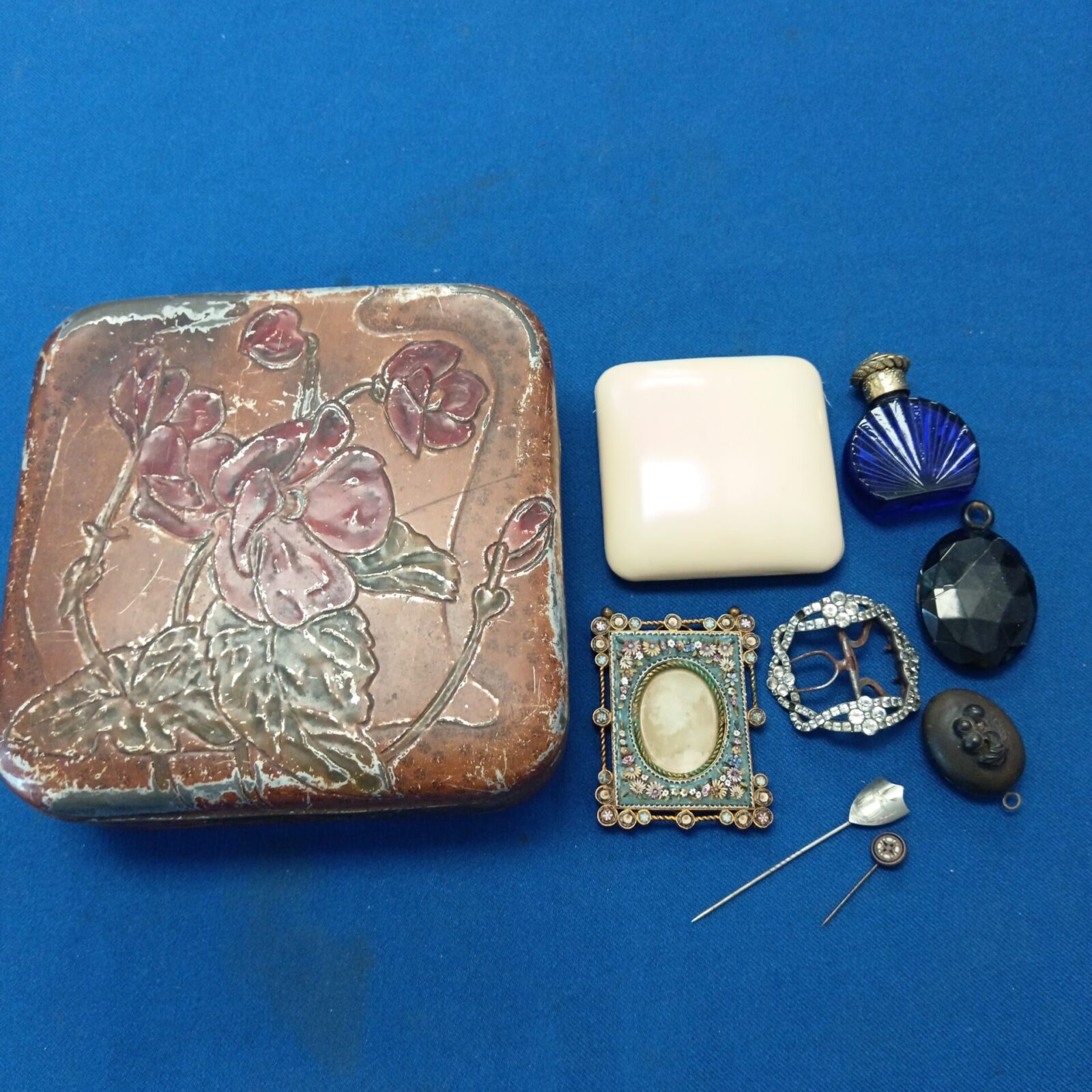 Antique tin with contents including Victorian mourning pendant & mosaic photo frame