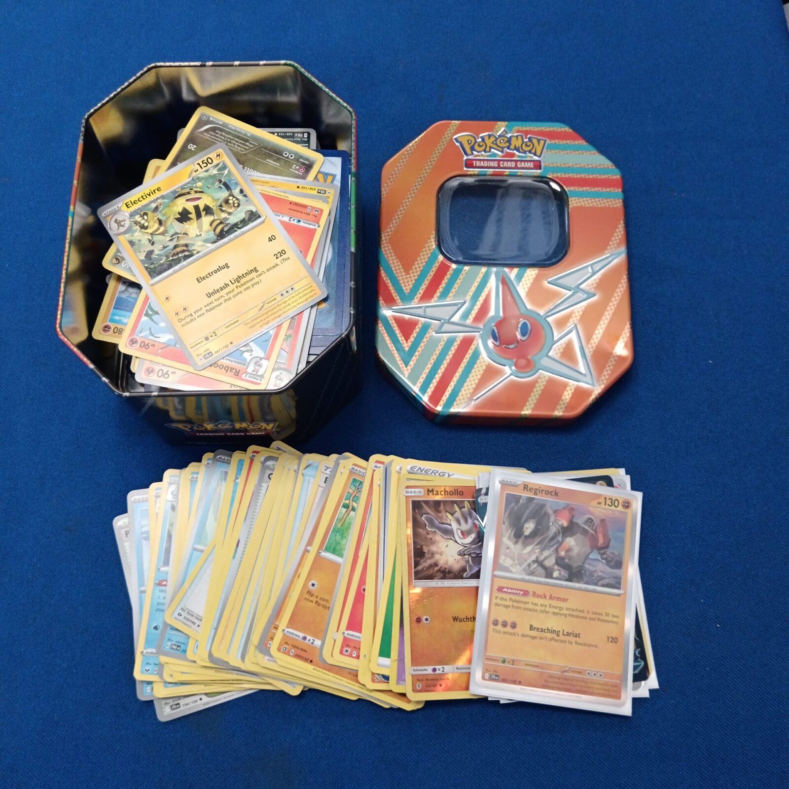 Tin of Pokémon cards including holos