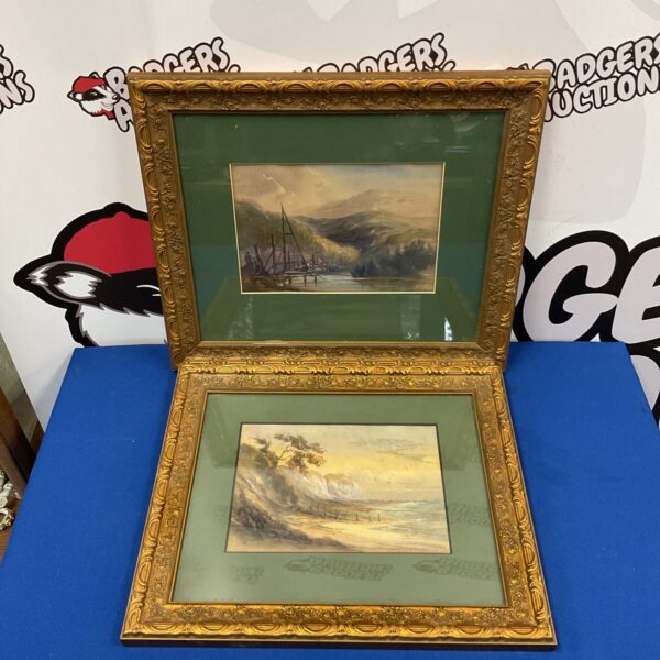 Antique pair of watercolour landscape paintings in gilt frames.