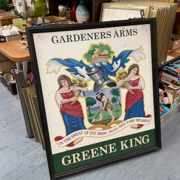 Vintage Greene King Gardeners Arms pub sign with painted scene.