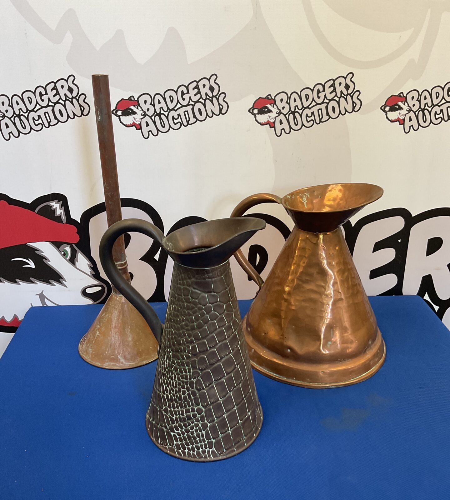 Two vintage copper pitchers & funnel