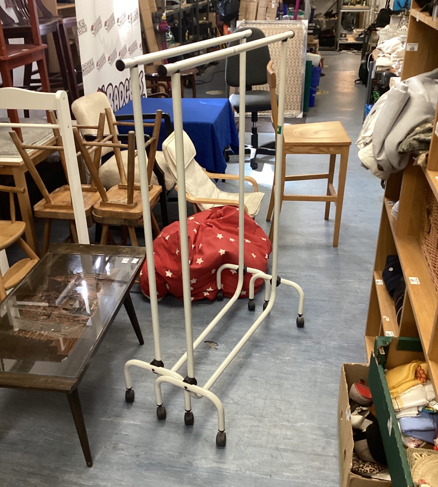 Two metal clothes rails on wheels
