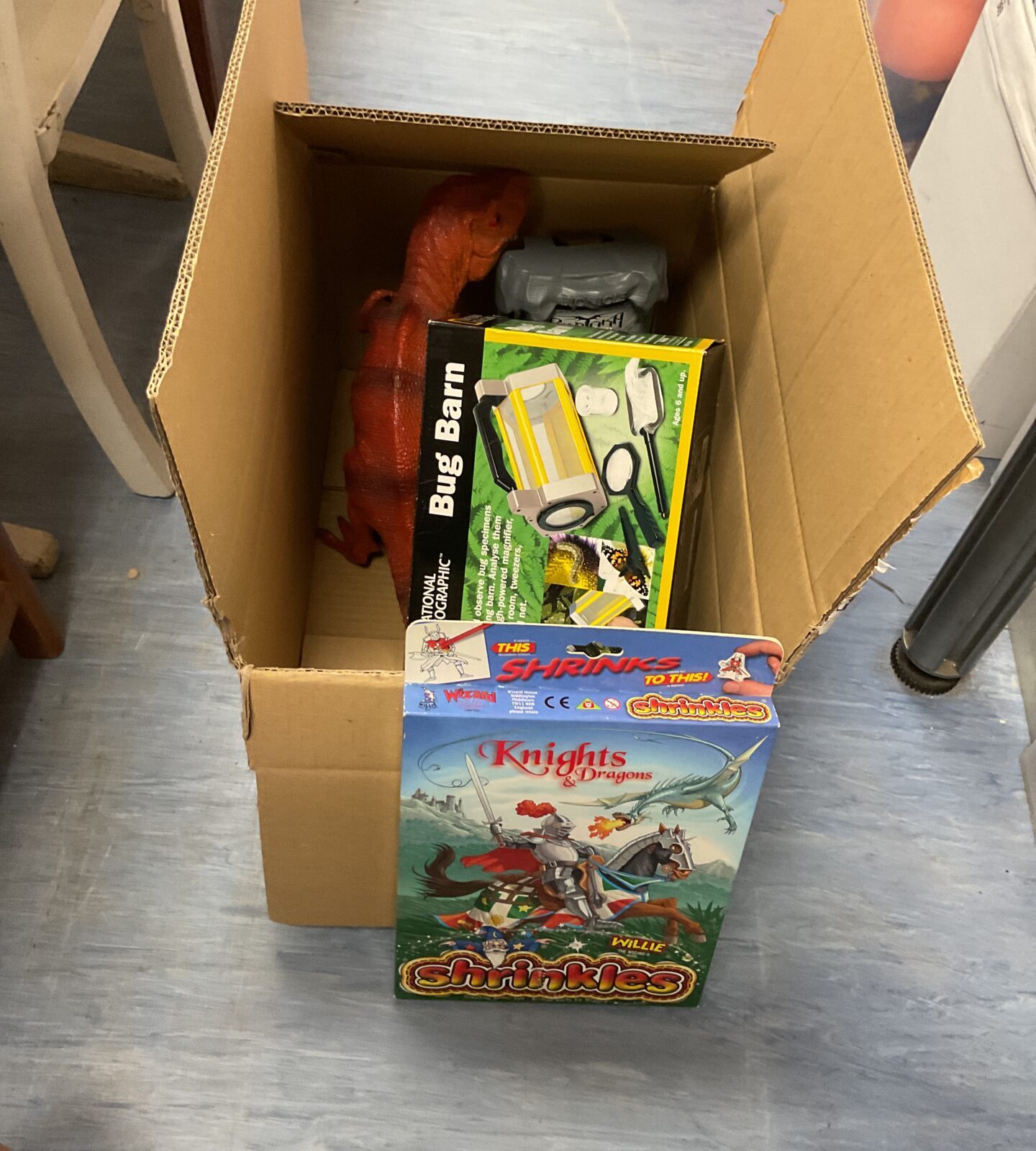 Box of mixed toys inc knights and dragons playset and national geographic bug barn