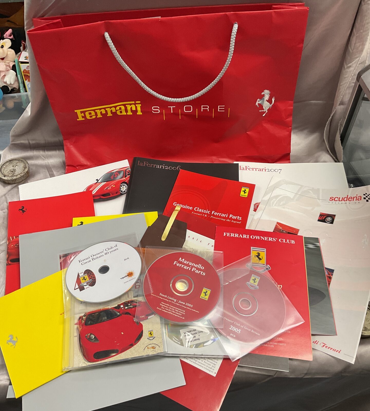 Ferrari bag of booklets and pamphlets inc Ferrari dvd and CDs