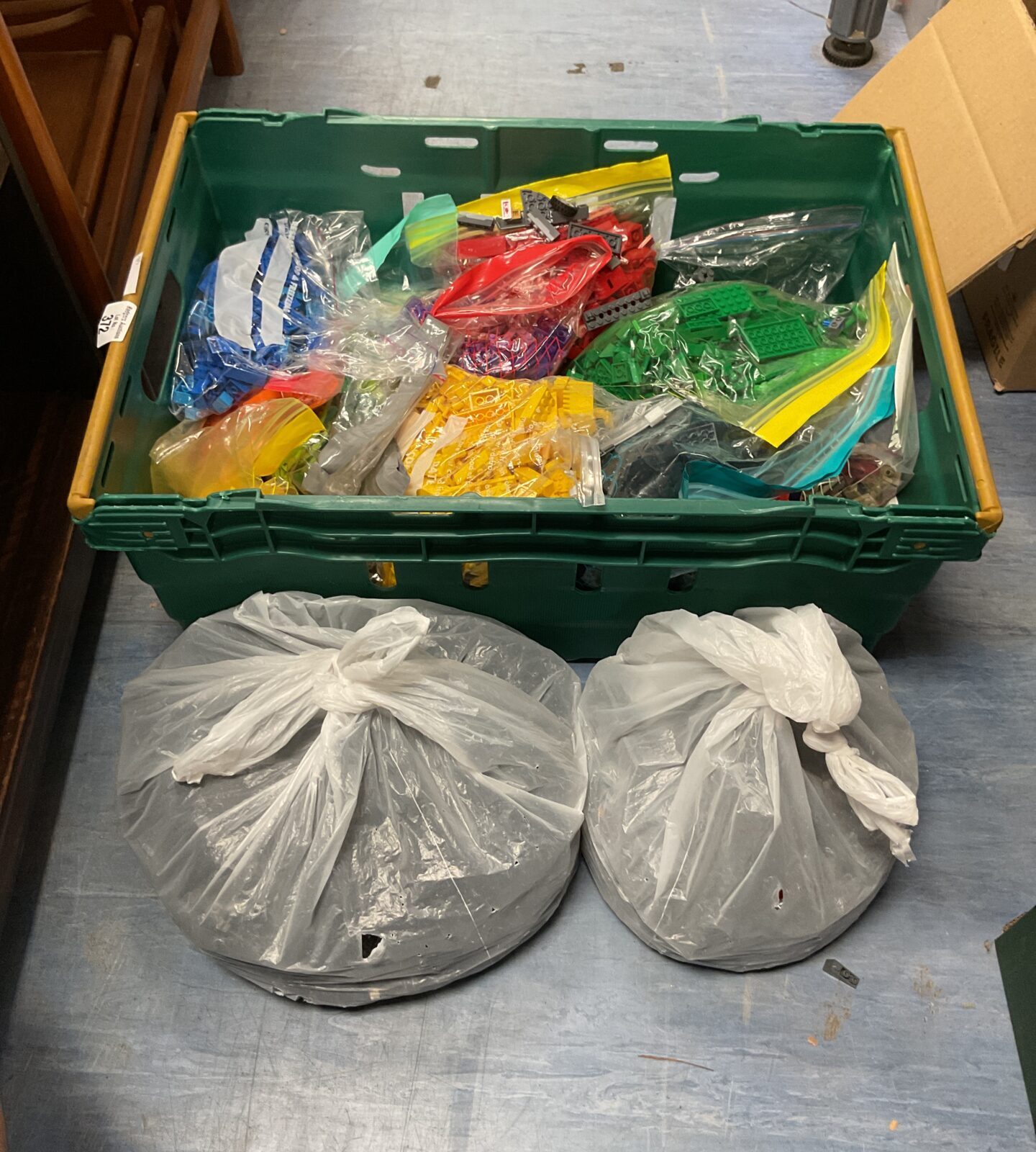 Crate of mixed colour organised lego bricks