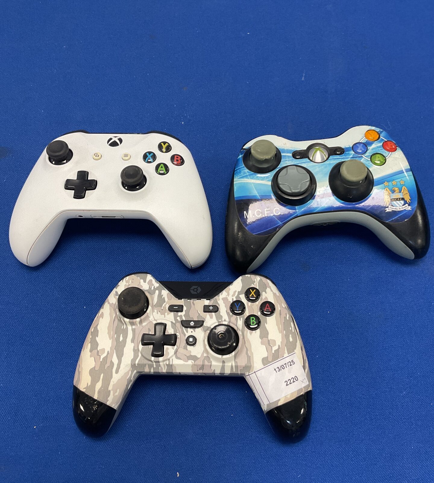 Three gaming controllers including xbox one & 360