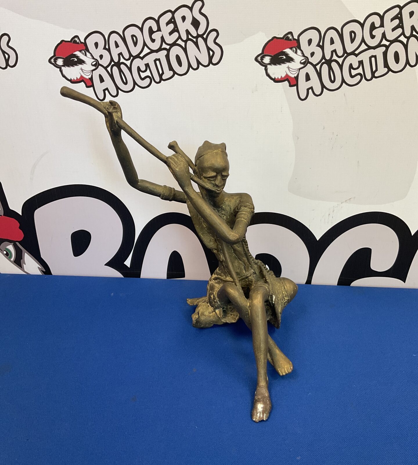 Brass African sculpture of a tribal musician