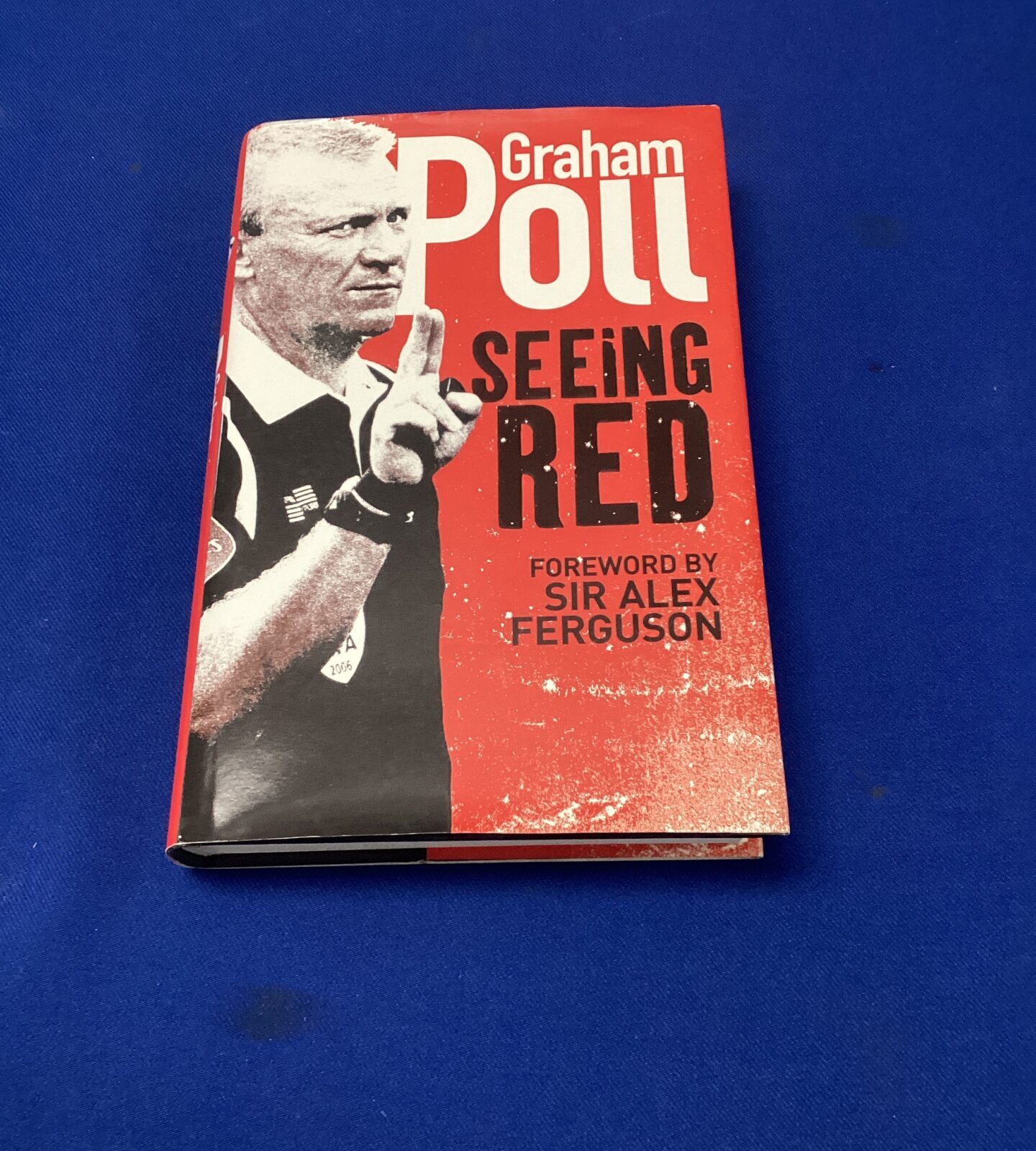 Signed coped of graham poll seeing red