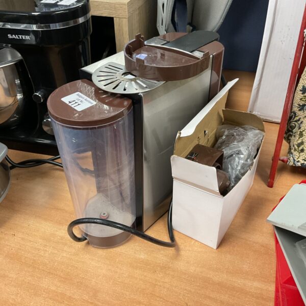 Vintage Kotlie coffee machine with brewing attachments for home use.
