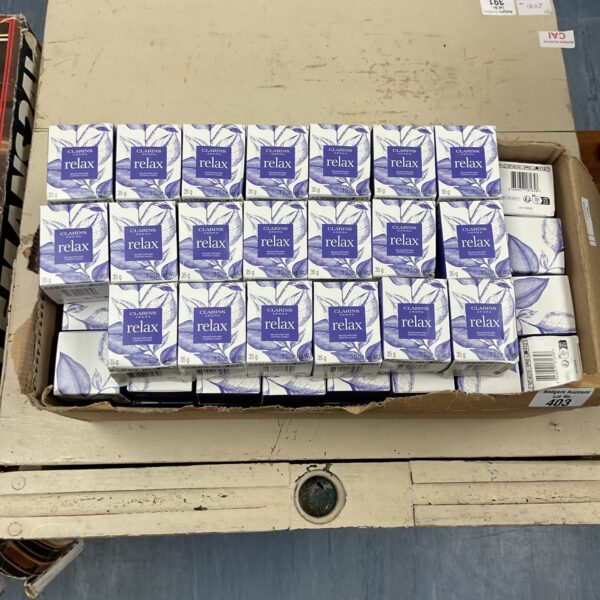Large lot of Clarins Aroma Relax scented candles for home fragrance.